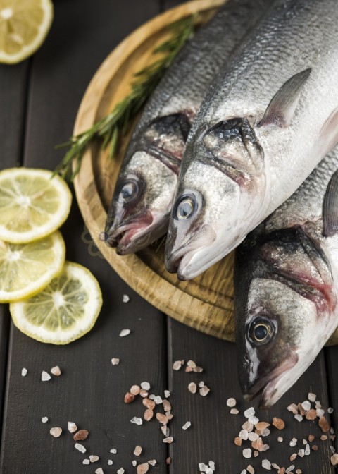 Top view fish with lemon salt